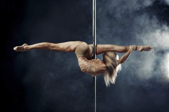 Girl dancing on a pole as announcement of European Championship 2027 in Aerial disciplines